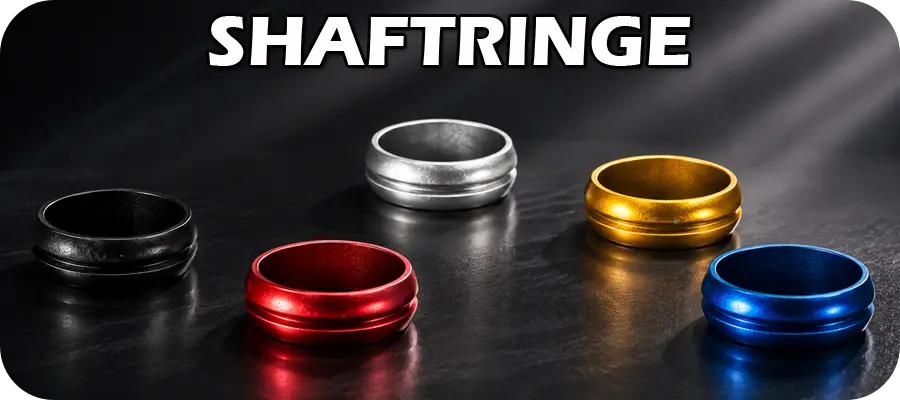 Shaftringe aus Metall in verschiedenen Farben als modernes Dart Zubehör auf dunklem Hintergrund